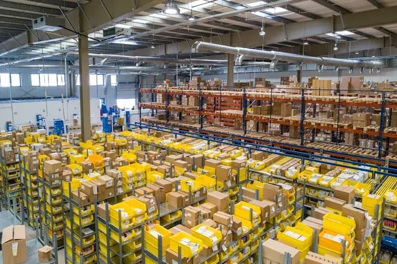 Racking and picking bins stacked with stock inside the GGFT warehouse